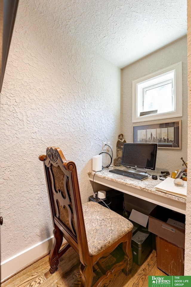 523 N 52nd St, Omaha, NE 68132 - home office featuring wood finished floors, a textured wall, and a textured ceiling