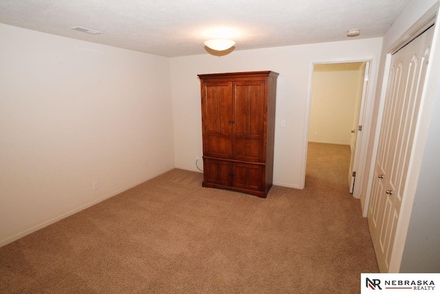 19122 Drexel St, Omaha, NE 68135 - unfurnished bedroom with light carpet and a closet