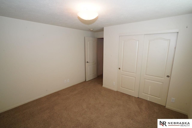 19122 Drexel St, Omaha, NE 68135 - unfurnished bedroom featuring light carpet and a closet