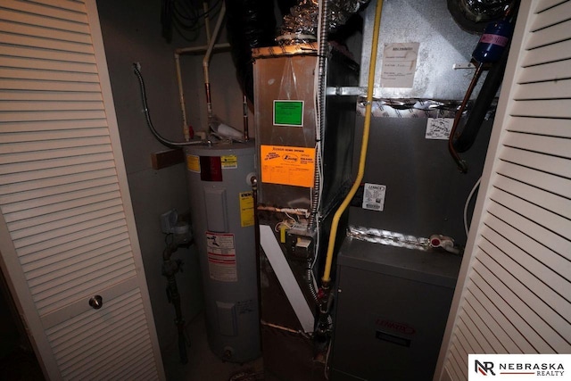 19122 Drexel St, Omaha, NE 68135 - utility room featuring water heater and heating unit