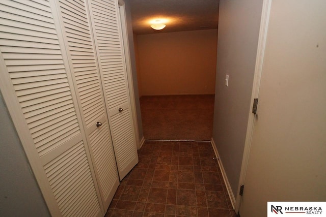 19122 Drexel St, Omaha, NE 68135 - corridor featuring baseboards and dark colored carpet