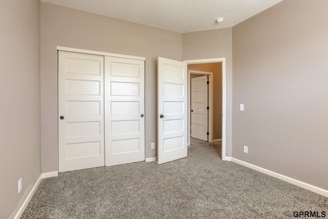 7810 S 184th Ave, Omaha, NE 68136 - unfurnished bedroom with carpet flooring, a closet, and baseboards