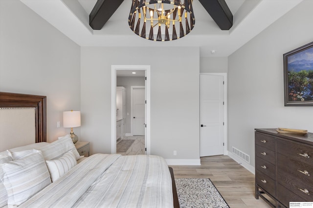 3307 S 209th St, Omaha, NE 68022 - bedroom featuring a chandelier, light wood-style flooring, connected bathroom, and a tray ceiling