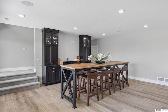 3307 S 209th St, Omaha, NE 68022 - dining room with light wood-type flooring, recessed lighting, and stairway