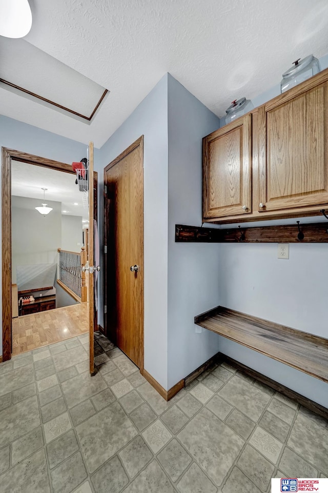 1035 Primrose Ln, Hickman, NE 68372 - corridor with baseboards and a textured ceiling