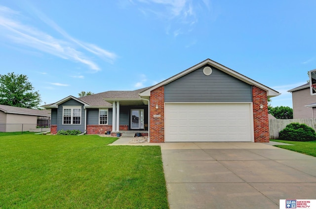 1035 Primrose Ln, Hickman, NE 68372 - ranch-style home with brick siding, concrete driveway, and an attached garage