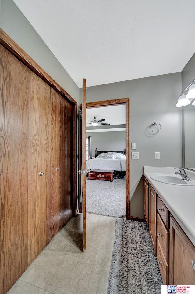1035 Primrose Ln, Hickman, NE 68372 - full bathroom with vanity, connected bathroom, and a ceiling fan