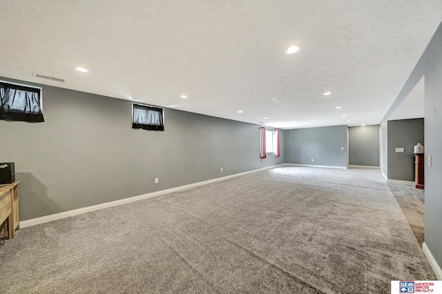 1035 Primrose Ln, Hickman, NE 68372 - below grade area with light colored carpet, recessed lighting, and baseboards