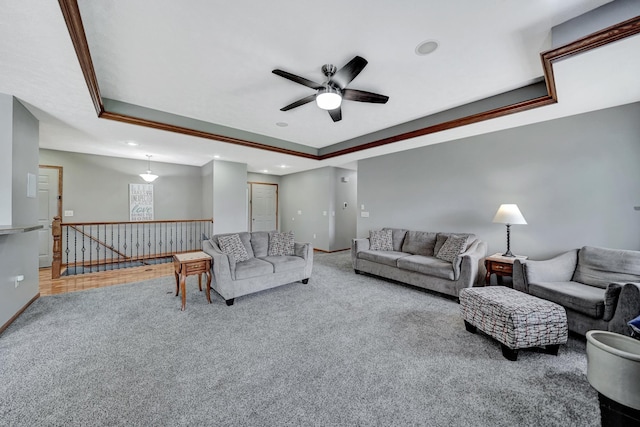 1035 Primrose Ln, Hickman, NE 68372 - carpeted living area with a tray ceiling, ceiling fan, recessed lighting, and baseboards