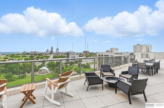 3200 Farnam Ct Unit 3409, Omaha, NE 68131 - view of patio / terrace with a fire pit and a city view