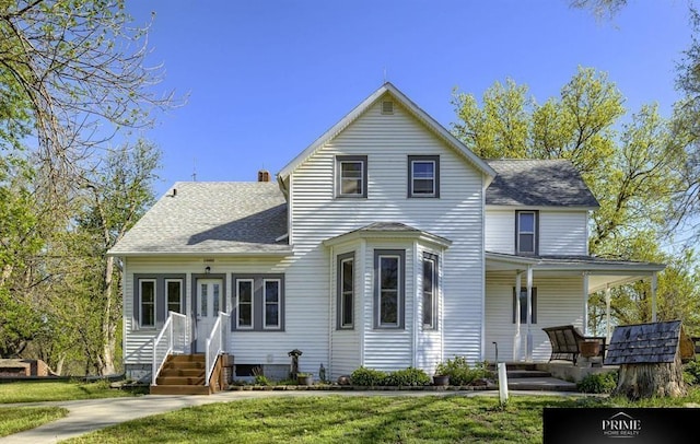 13602 S 36th St, Bellevue, NE 68123 - view of front of house featuring a shingled roof and a front lawn