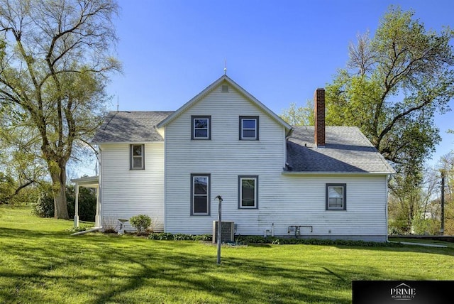 13602 S 36th St, Bellevue, NE 68123 - rear view of property featuring a chimney, a yard, and a shingled roof