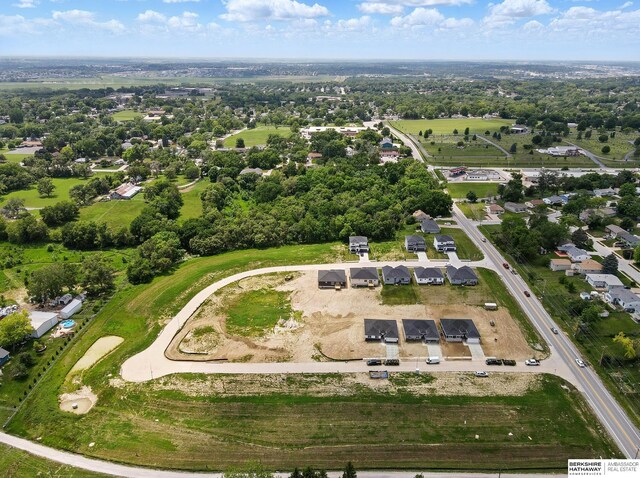 7613 S 34th St, Bellevue, NE 68147 - aerial overview of property's location featuring a tree filled landscape and nearby suburban area