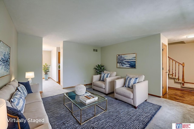 7940 Zachary Cir, Lincoln, NE 68507 - living room featuring light carpet and stairway