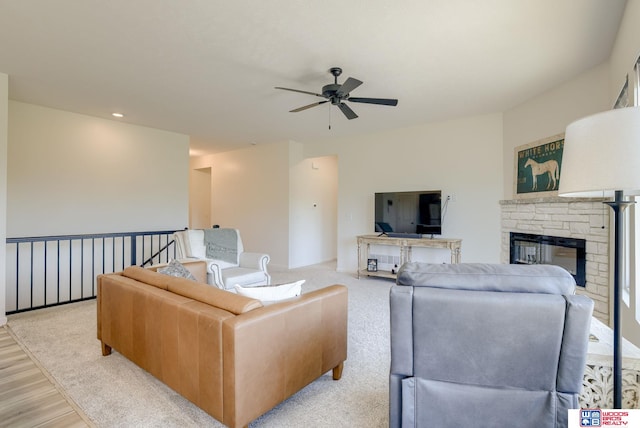 9221 S 177th St, Omaha, NE 68136 - living room with ceiling fan, a stone fireplace, light wood-style floors, and recessed lighting
