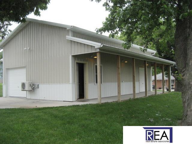 4521 A St, Omaha, NE 68106 - view of side of property featuring a porch and a lawn