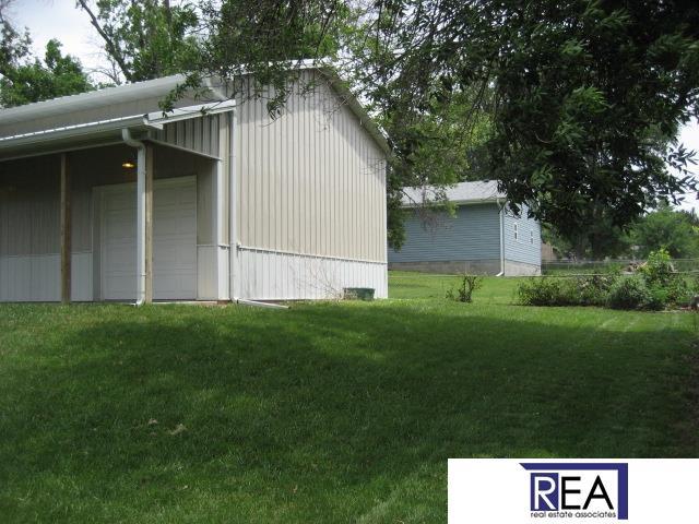 4521 A St, Omaha, NE 68106 - view of property exterior featuring a yard and a garage