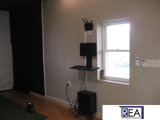 4521 A St, Omaha, NE 68106 - unfurnished bedroom featuring wood finished floors and baseboards