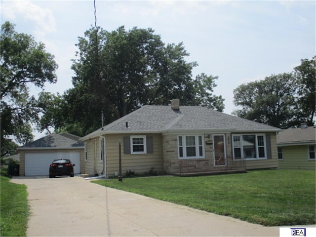 4521 A St, Omaha, NE 68106 - view of front of home with a front yard, a garage, and a chimney