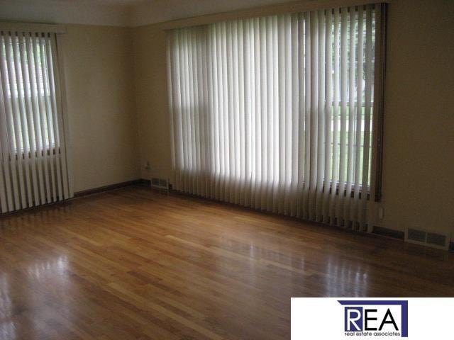 4521 A St, Omaha, NE 68106 - spare room featuring wood finished floors