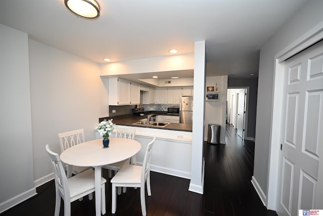 139 N 11th St Unit 904, Lincoln, NE 68508 - dining area featuring dark wood finished floors and recessed lighting