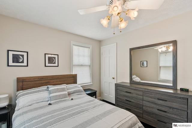 5042 Corby St, Omaha, NE 68104 - bedroom featuring ceiling fan and baseboards