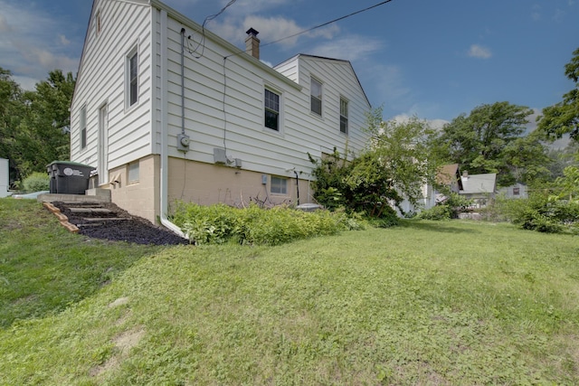 5042 Corby St, Omaha, NE 68104 - view of side of property featuring a yard and a chimney