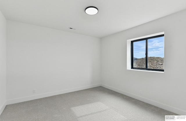 16951 Benjamin St, Bennington, NE 68007 - empty room featuring light carpet and baseboards