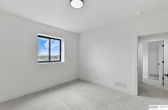 16951 Benjamin St, Bennington, NE 68007 - carpeted spare room featuring baseboards and a smoke detector