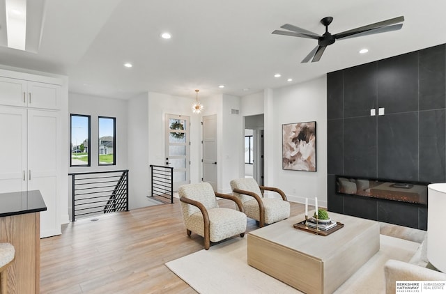 16951 Benjamin St, Bennington, NE 68007 - living area featuring light wood-style floors, recessed lighting, and ceiling fan
