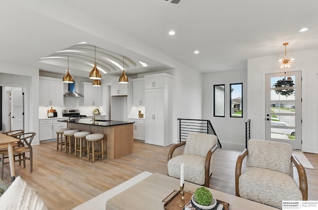 16951 Benjamin St, Bennington, NE 68007 - living area with light wood-type flooring and recessed lighting