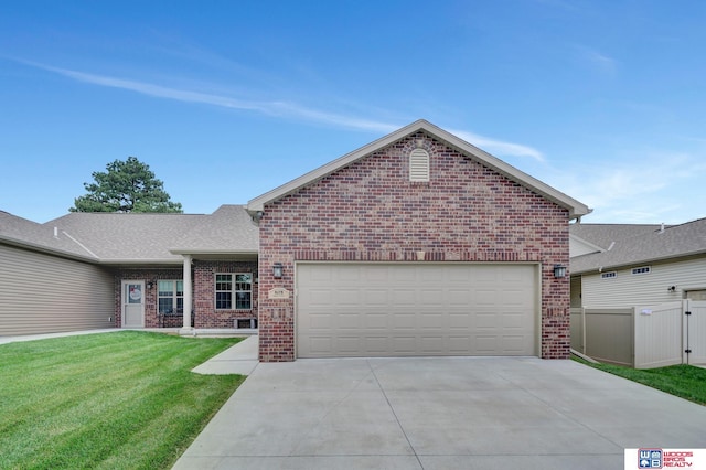 8178 Regent Dr, Lincoln, NE 68507 - single story home featuring brick siding, concrete driveway, and a garage