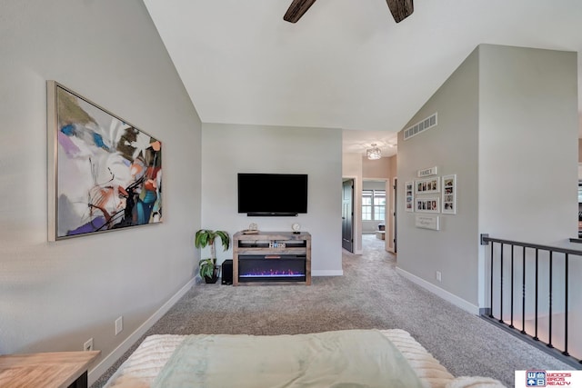 8178 Regent Dr, Lincoln, NE 68507 - carpeted living room featuring a ceiling fan and high vaulted ceiling