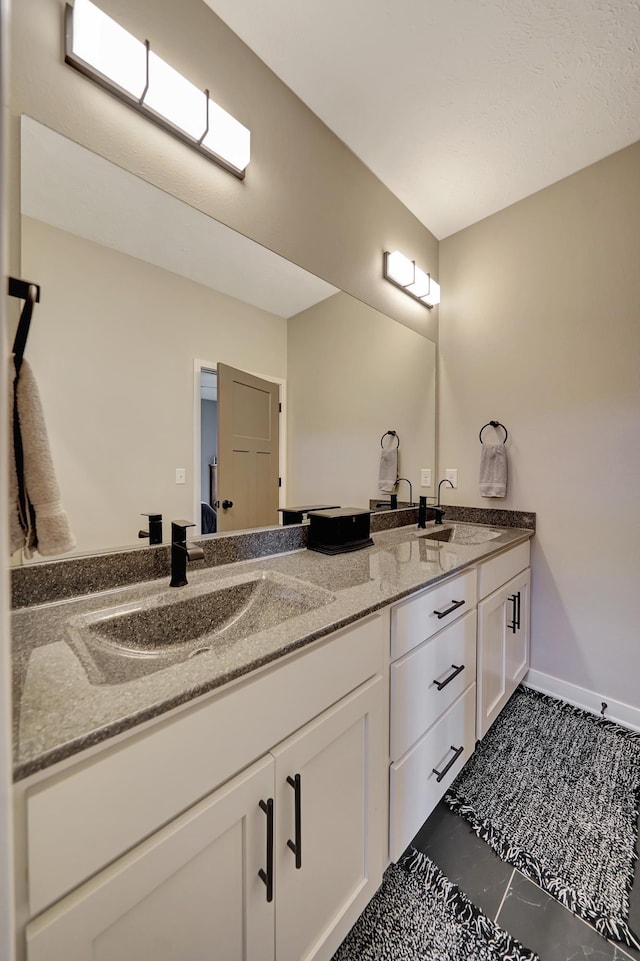 8178 Regent Dr, Lincoln, NE 68507 - full bath with double vanity and tile patterned flooring