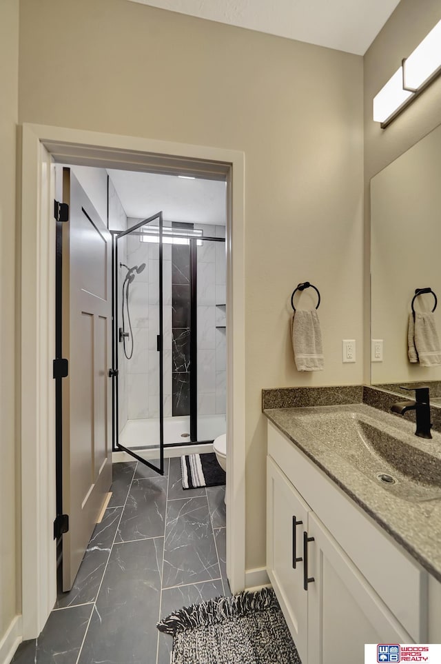 8178 Regent Dr, Lincoln, NE 68507 - full bath featuring marble finish flooring, vanity, and a stall shower