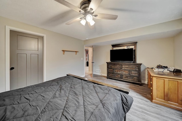 8178 Regent Dr, Lincoln, NE 68507 - bedroom with light wood-style flooring and a ceiling fan