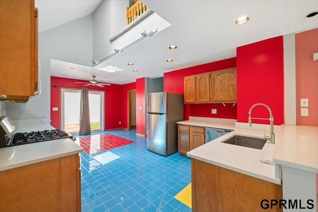 3018 Frederick St S, Omaha, NE 68105 - kitchen with stainless steel appliances, brown cabinets, recessed lighting, a ceiling fan, and a peninsula