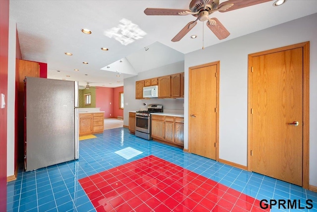 3018 Frederick St S, Omaha, NE 68105 - kitchen with stainless steel appliances, vaulted ceiling, recessed lighting, ceiling fan, and light countertops