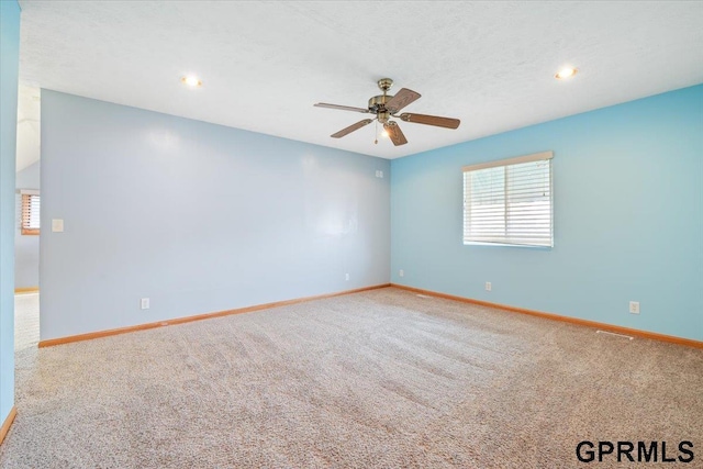 3018 Frederick St S, Omaha, NE 68105 - carpeted spare room featuring a ceiling fan and recessed lighting