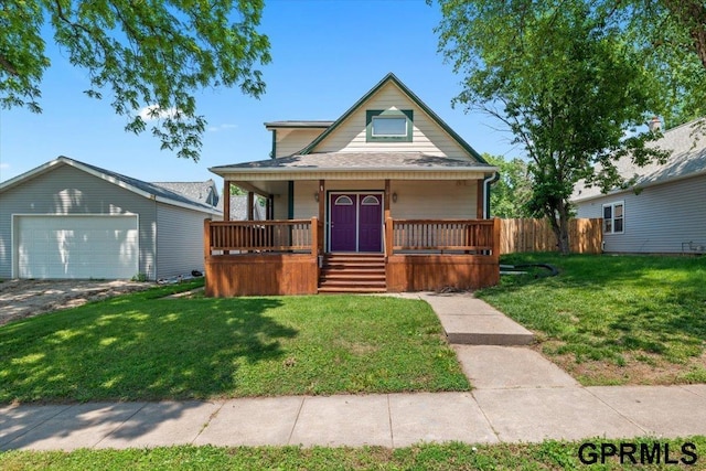 3018 Frederick St S, Omaha, NE 68105 - bungalow-style home featuring covered porch, a detached garage, and an outbuilding