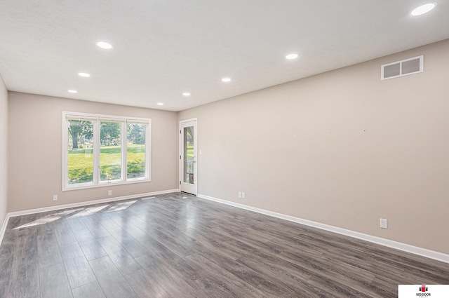 7420 S St S Unit 13, Lincoln, NE 68506 - spare room featuring dark wood-style flooring and recessed lighting