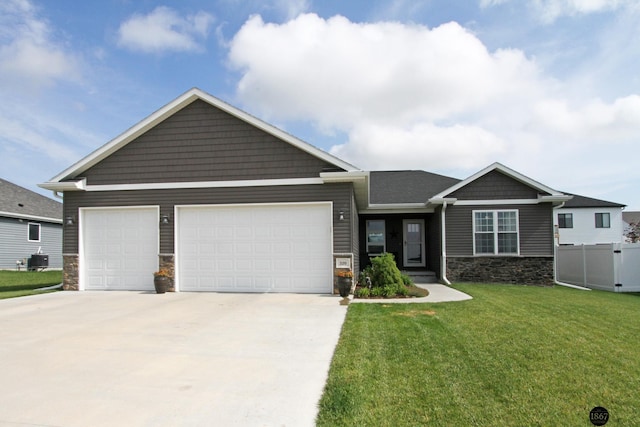 320 Woodland Blvd, Hickman, NE 68372 - craftsman house with stone siding, a garage, and driveway