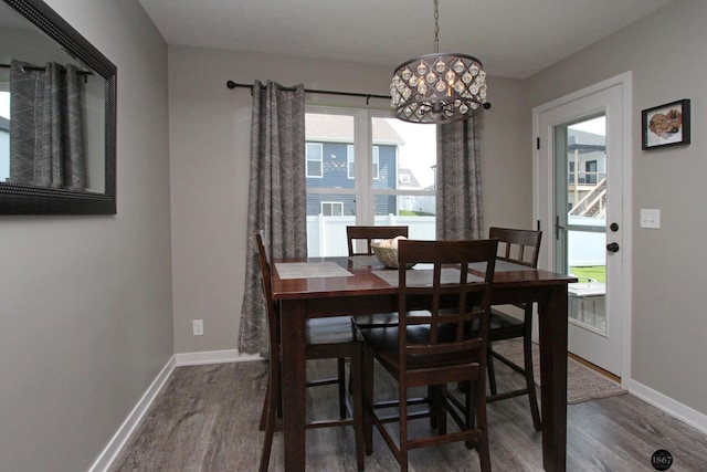 320 Woodland Blvd, Hickman, NE 68372 - dining room with wood finished floors and a chandelier