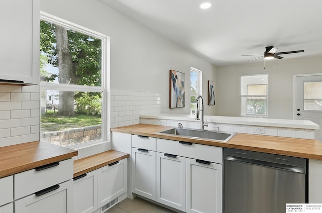 3410 U St, Omaha, NE 68107 - kitchen with wood counters, stainless steel dishwasher, plenty of natural light, ceiling fan, and recessed lighting