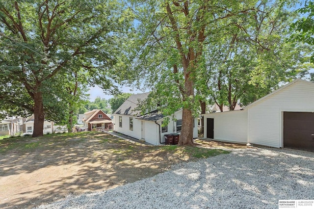 3410 U St, Omaha, NE 68107 - view of front of property with gravel driveway and a garage