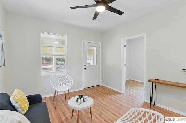 3410 U St, Omaha, NE 68107 - living room with light wood-style floors and ceiling fan