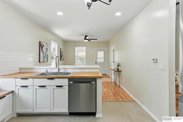 3410 U St, Omaha, NE 68107 - kitchen with wood counters, dishwasher, ceiling fan, a peninsula, and white cabinetry