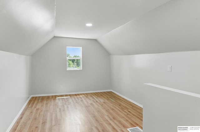 3410 U St, Omaha, NE 68107 - additional living space featuring light wood-type flooring and lofted ceiling