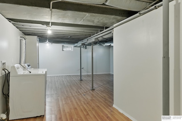 3410 U St, Omaha, NE 68107 - below grade area featuring separate washer and dryer and wood finished floors