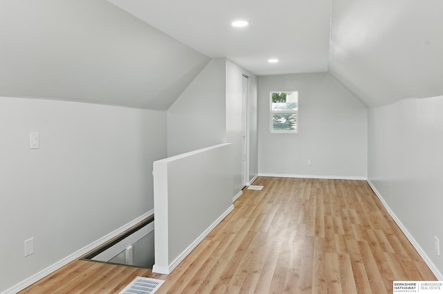 3410 U St, Omaha, NE 68107 - additional living space with light wood-type flooring, lofted ceiling, and recessed lighting